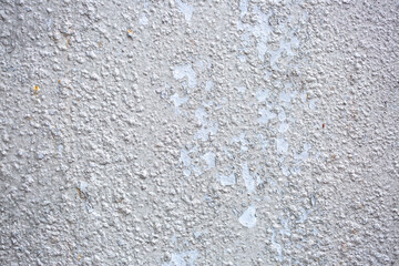 Texture of paint stains on the wall, cracked paint on an old metal surface. Sheet of silver metal with cracked and peeling paint, background for design with copy space.