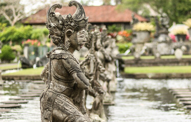 Fototapeta na wymiar Traditional Balinese statues in the water temple in Bali, Indonesia