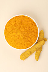 Turmeric roots with turmeric powder