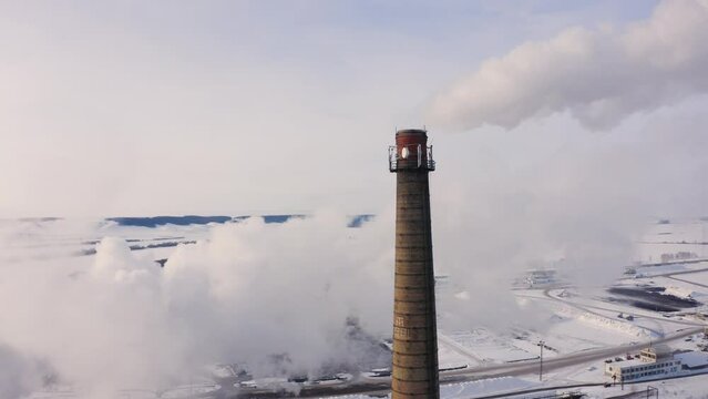 Aerial view of steam from the chimney of a sugar factory