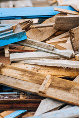 Background, texture of a pile of old, used wooden boards with nails. Close-up photo, construction concept.