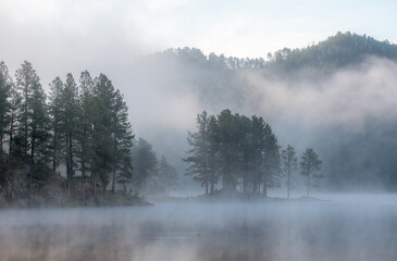 Obraz na płótnie Canvas Early Morning Mist on Stockade Lake in the Black Hills of South Dakota