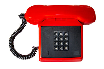Old red telephone. Close-up of a vintage red phone with black cable and retro push buttoms. Clipping path. Contact exchange and call centre. Telecommunication technology.