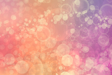 A festive abstract orange pink yellow gradient background texture with glitter defocused sparkle bokeh circles. Card concept for Happy New Year, party invitation, valentine or other holidays.