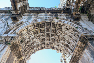 Fototapeta premium bottom view of the ancient arch of the entrance city gates in the Turkish city of Antalya