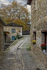 Fototapeta na wymiar The picturesque village of Tsepelovo during fall season with its architectural traditional old stone buildings located on Tymfi mount, Zagori, Epirus, Greece, Europe