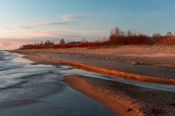 Rocky beach of the Baltic Sea at sunset