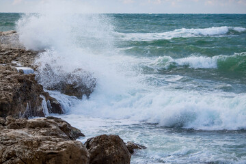 Beautiful seascape. The Black Sea coast. The waves are beating against the rocks. Russia, Crimea.