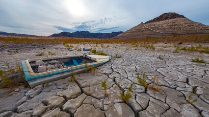 Sunken boat in dried up Lake Mead aera
