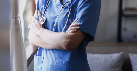 Homecare nursing service and elderly people cardiology healthcare. Close up of young hispanic female doctor nurse check mature caucasian man patient heartbeat using stethoscope during visit