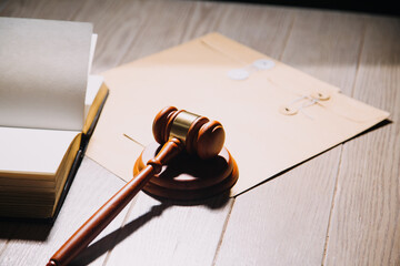 Justice and law concept.Male judge in a courtroom with the gavel, working with, computer and...