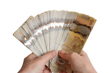 Closeup person's hands holding large sum of Canadian cash money