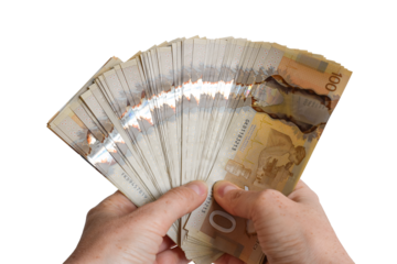 Closeup person's hands holding large sum of Canadian cash money