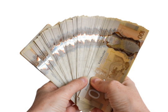 Closeup person's hands holding large sum of Canadian cash money - Powered by Adobe