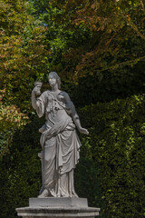 Fototapeta na wymiar Antique sculpture in Gardens of Versailles palace. Versailles, France.