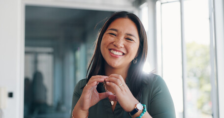 Asian woman, face and smile with hands in heart shape, emoji or love gesture for creative career at...