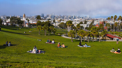 Fototapeta na wymiar People relaxing at Mission Delores Park in San Francisco, California