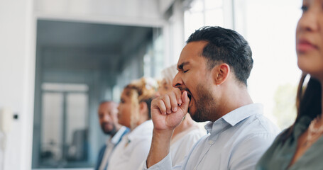 Tired, yawn and sleepless with a business man sitting in a meeting or presentation with his team...