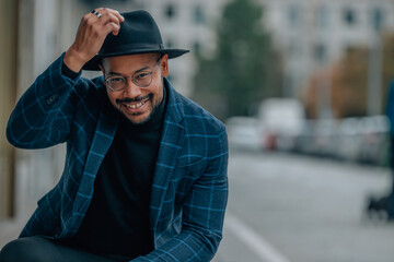 latin-american man on the street smiling