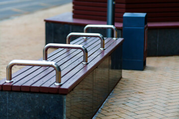 A park bench that does not allow you to sleep on it