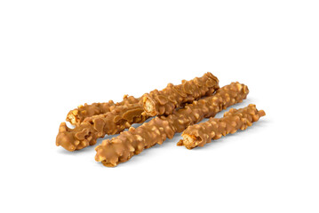 Cracker pretzel sticks toffee-cream glazing and peanuts isolated on white background.