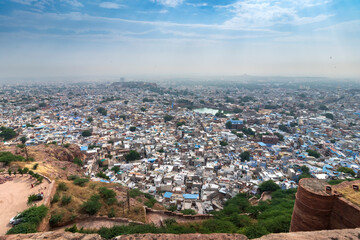 Top view of Jodhpur city as seen from famous Mehrangarh fort, Jodhpur, Rajasthan, India. Blue sky in the background. Mehrangarh Fort is UNESCO world heritage site popular amongst tourists worldwide.