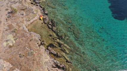 Aerial drone photo of tropical exotic paradise bay with deep turquoise sea forming a blue lagoon