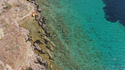 Aerial drone photo of tropical exotic paradise bay with deep turquoise sea forming a blue lagoon
