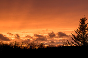 Dramatic clouds on the sky in red colors in the area called Rothaargebirge
