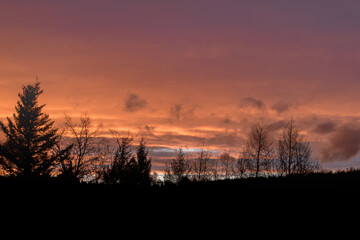 Dramatic clouds on the sky in red colors in the area called Rothaargebirge