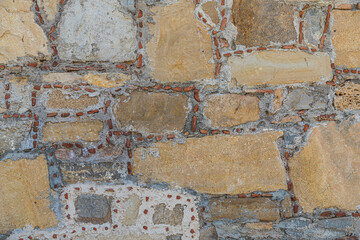 The texture of the stone wall. Background texture of the stone wall of the old castle.