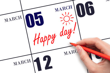 Hand writing the text HAPPY DAY and drawing the sun on the calendar date March 5