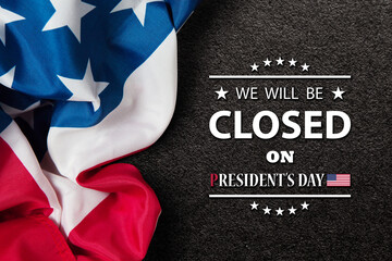 Obraz na płótnie Canvas President's Day Background Design. American flag on textured black background with a message. We will be Closed on President's Day.