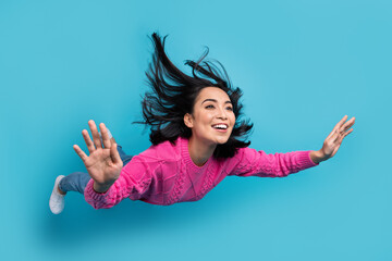 Full length photo of shiny charming woman dressed pink sweater flying falling sky isolated blue...
