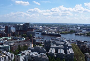 Obraz premium Bird's- eye view of Hamburg - cargo ship, building, canal, Elbphilharmonie Concert Hall 