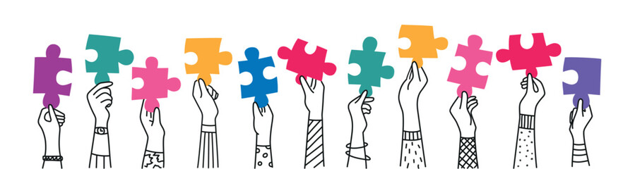 Arms of hands of people or co-workers holding jigsaw puzzle.