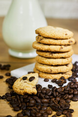 Coffee bean, homemade tasty cookies and milk bottle