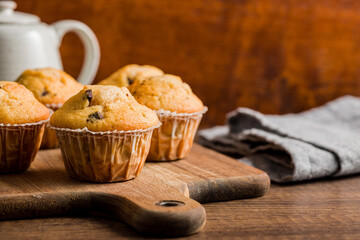 Sweet vanilla muffins  on cutting board.