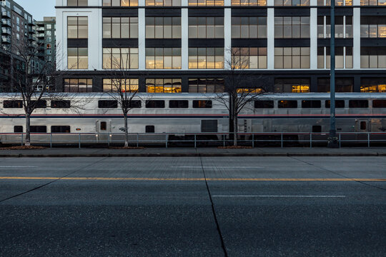 Amtrak passenger train passing through downtown Seattle waterfront