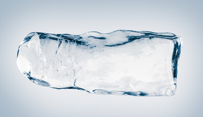 Crystal clear natural ice block in light blue tones on a white background.