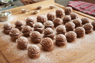 Traditional Christmas cookies  on a wooden rolling board