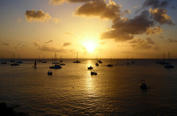 Colourful caribbean sunset with sailboats, Martinique island.