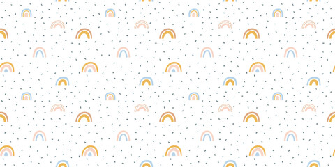 Abstract rainbow seamless pattern illustration. Soft pastel color doodle rainbows in childish freehand style for children or cute background design.