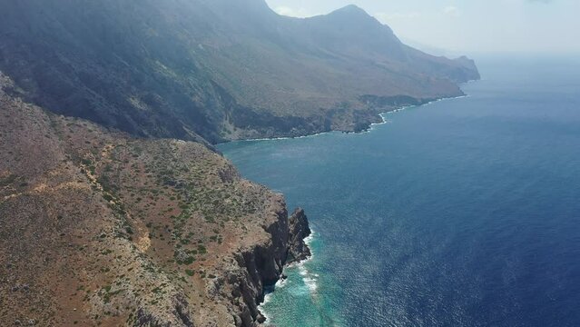 In the left side is mountains and the right side is the Libian sea in Crete, Greece