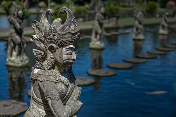 Fototapeta na wymiar Stone creatures at Tirta Gangga park, Bali Indonesia
