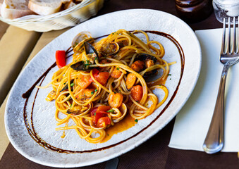 Plate of pasta with seafood - traditional Italian dish