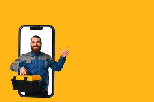 Banner Size Shot Of A Handyman With A Box Of Tools Coming Out Of A Phone.