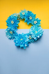 Blue and yellow background with blue flowers on it. Stand with Ukraine