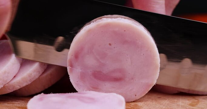 Sliced round-shaped ham from chicken meat, freshly sliced chicken ham in the kitchen