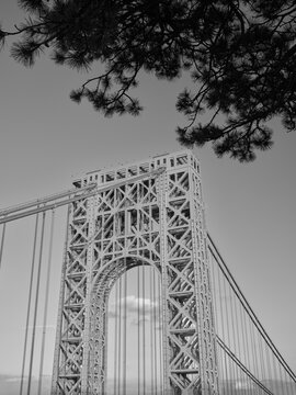Black and white vertical image of one of the suspension towers supporting the George Washington Bridge spanning the Hudson River from Fort Lee NJ to upper Manhattan